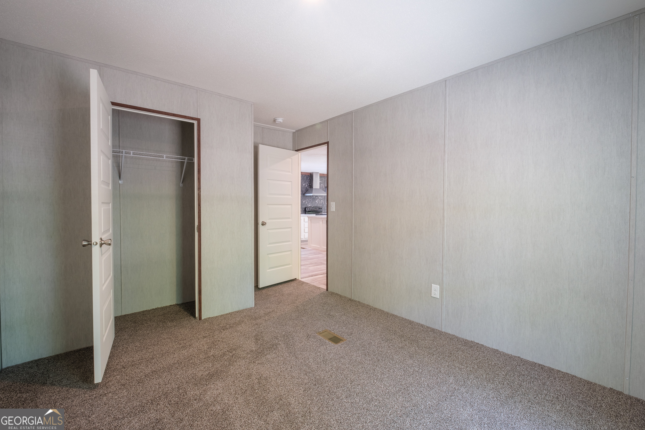 2959 Lake Lannell Road Odum, GA 31555 - Photo 22 of 30 a view of an empty room and closet area