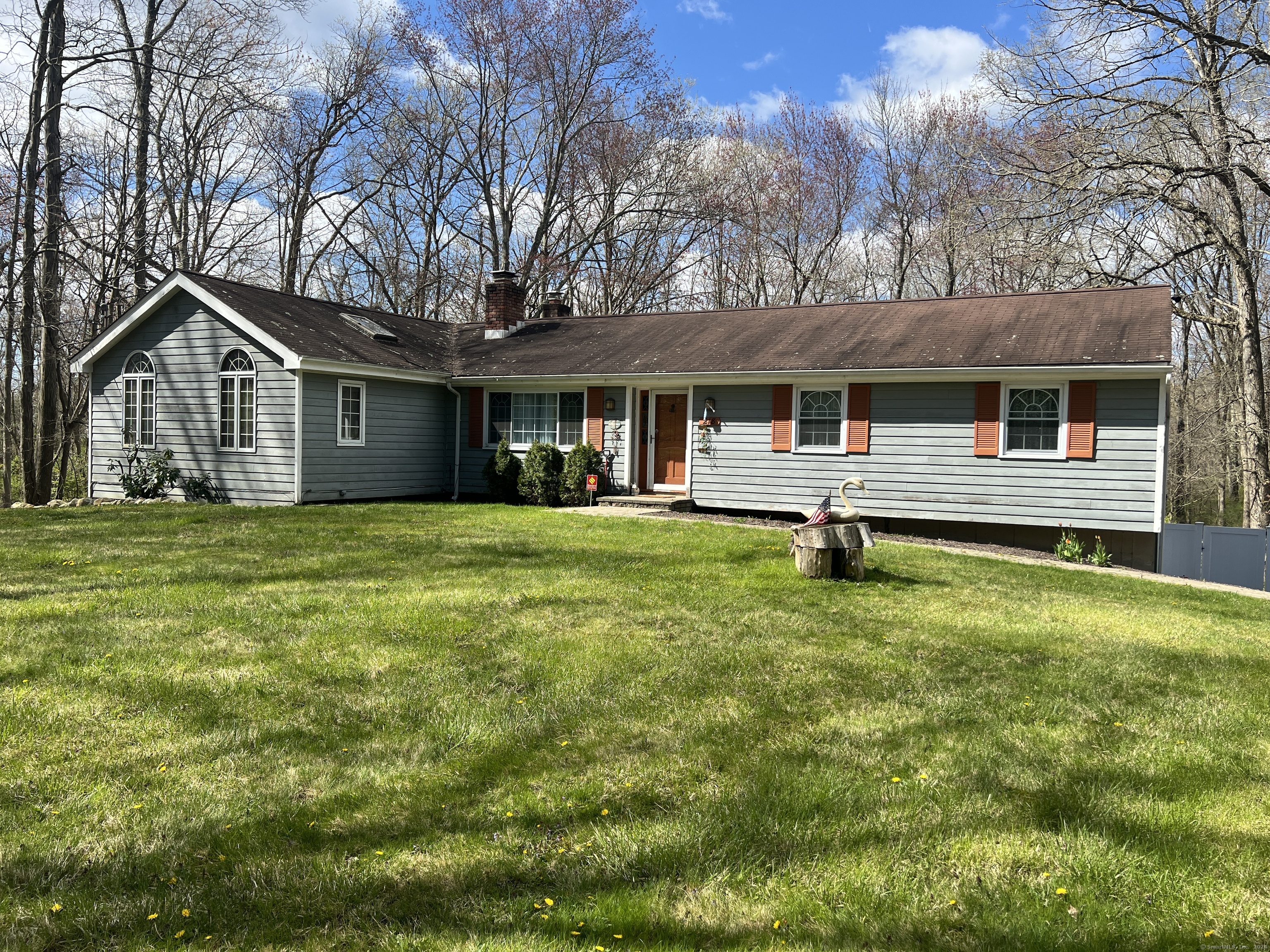 218 Old Hawleyville Road Bethel, CT 06801 - Photo 1 of 1 a front view of house with yard and trees in the background