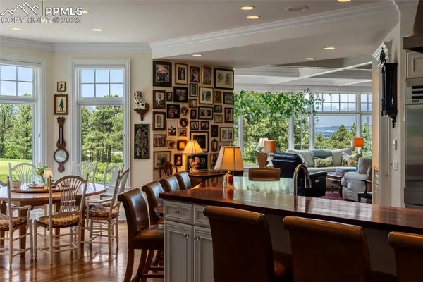 a view of a dining room with furniture window and outside view
