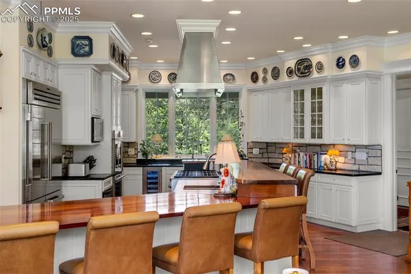 a large kitchen with lots of counter space and windows