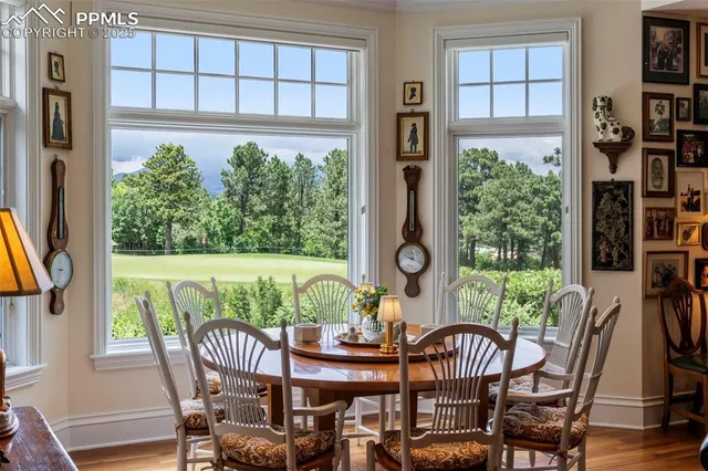 a view of a chairs and table in the balcony