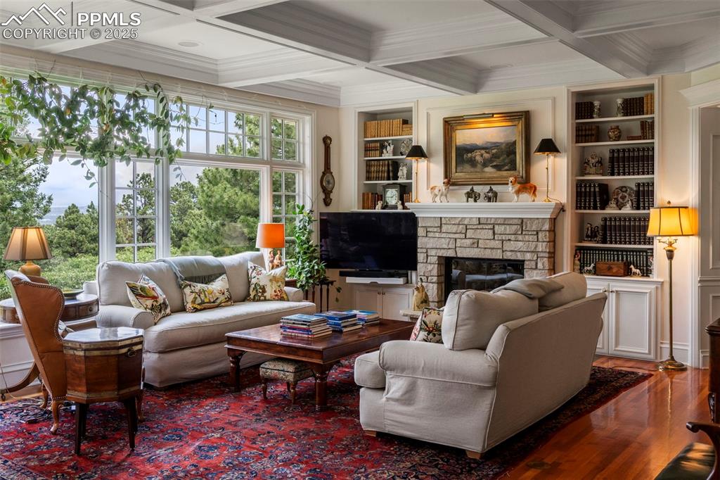 104 Marland Road Colorado Springs, CO 80906 - Photo 16 of 50 a living room with furniture a flat screen tv and a fireplace