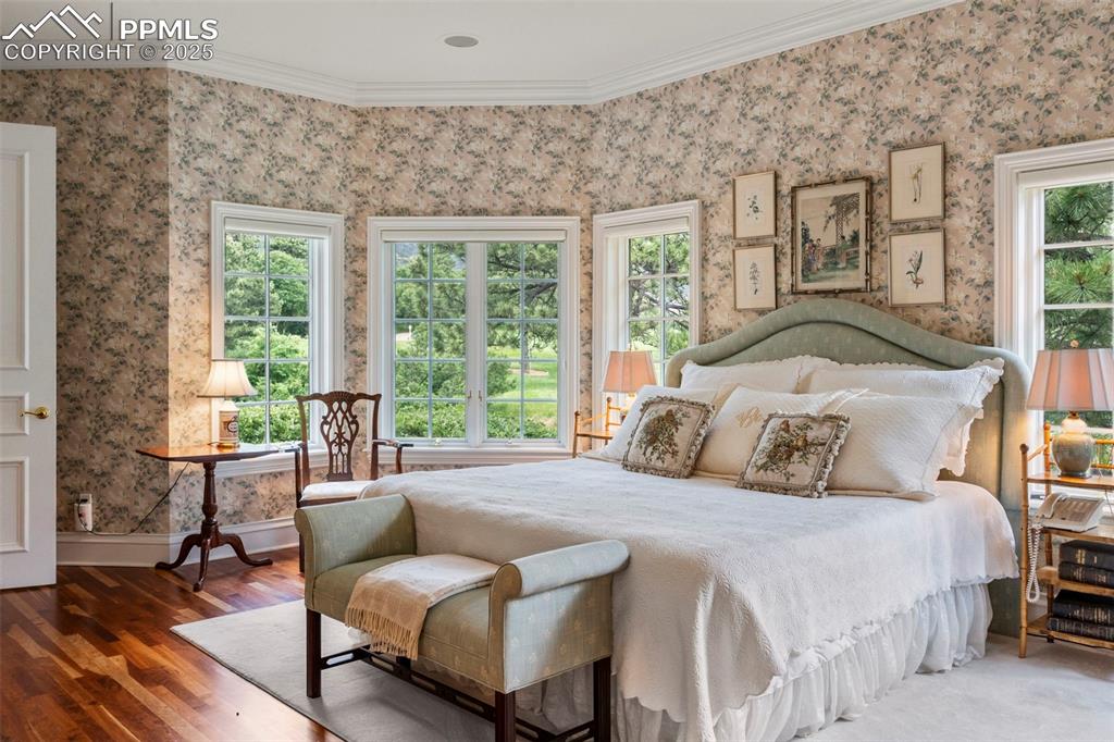 104 Marland Road Colorado Springs, CO 80906 - Photo 21 of 50 a bedroom with a bed couch and a large window