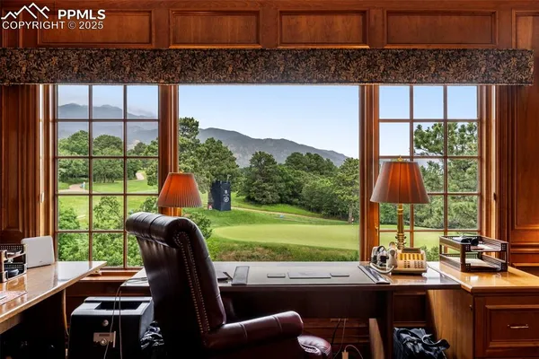 a view of a city from a dining room with large windows