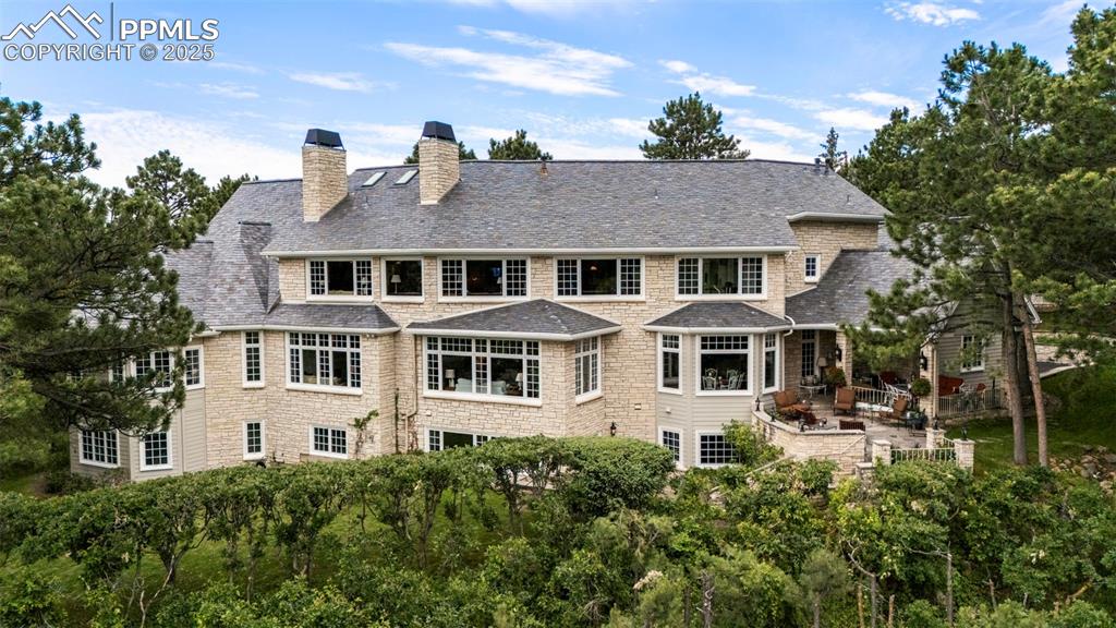 104 Marland Road Colorado Springs, CO 80906 - Photo 3 of 50 a front view of a house with a yard