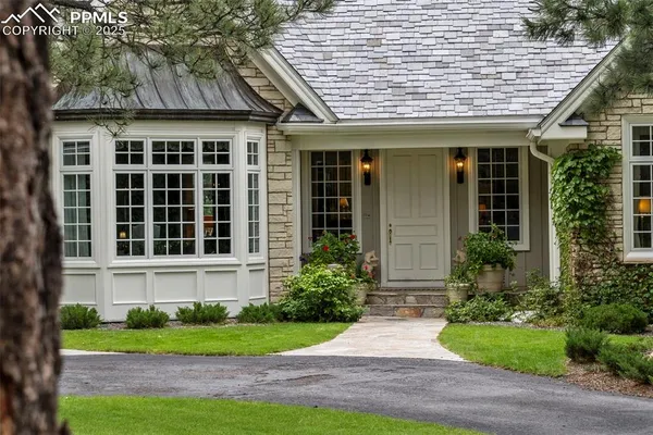 a front view of a house with garden