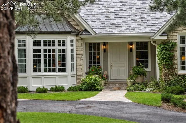 a front view of a house with garden