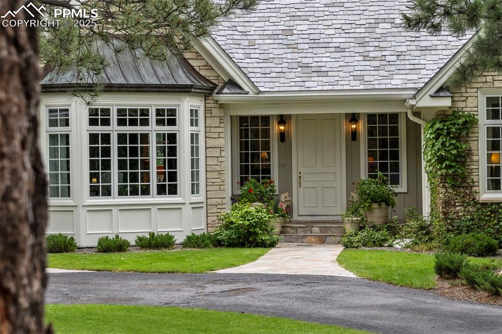 104 Marland Road Colorado Springs, CO 80906 - Photo 4 of 50 a front view of a house with garden