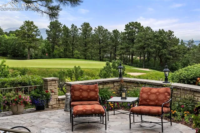 a view of a chair and tables in the backyard
