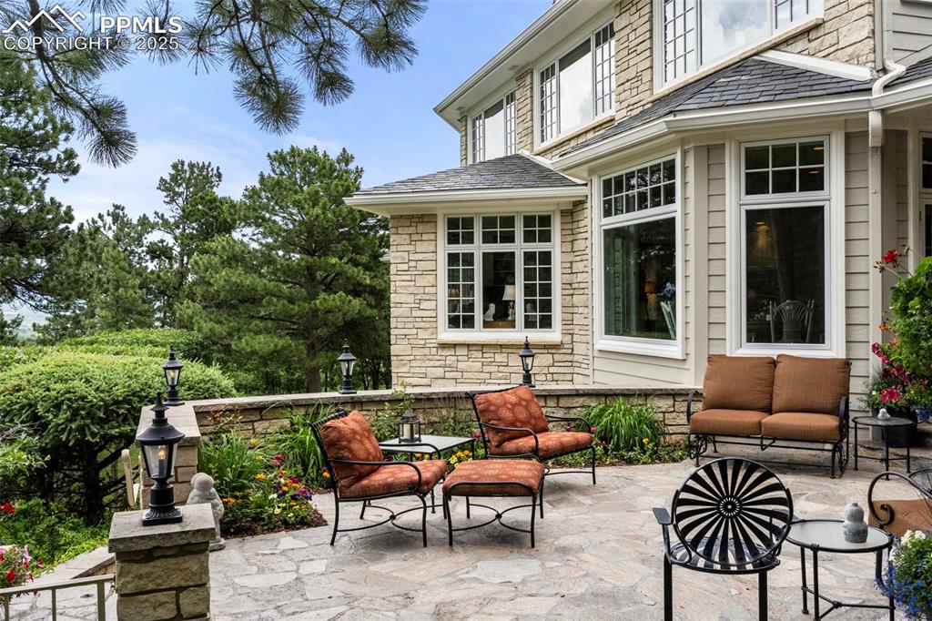 104 Marland Road Colorado Springs, CO 80906 - Photo 43 of 50 a view of a patio with a chairs and table in a patio