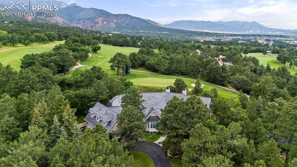104 Marland Road Colorado Springs, CO 80906 - Photo 49 of 50 an aerial view of a city with lots of residential buildings mountain and mountain view in back