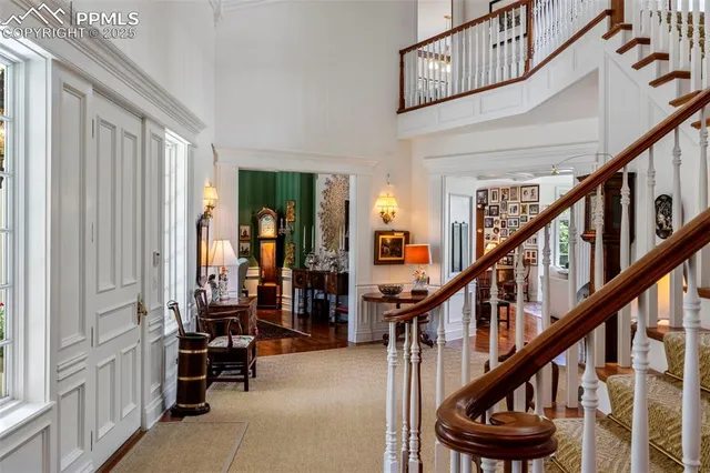 a view of entryway with livingroom and stairs