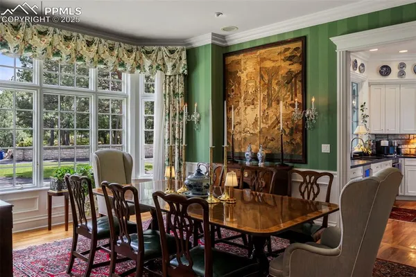 a view of a dining room with furniture window and outside view