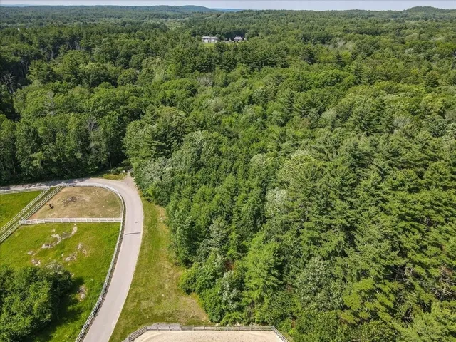 a view of a swimming pool with a yard