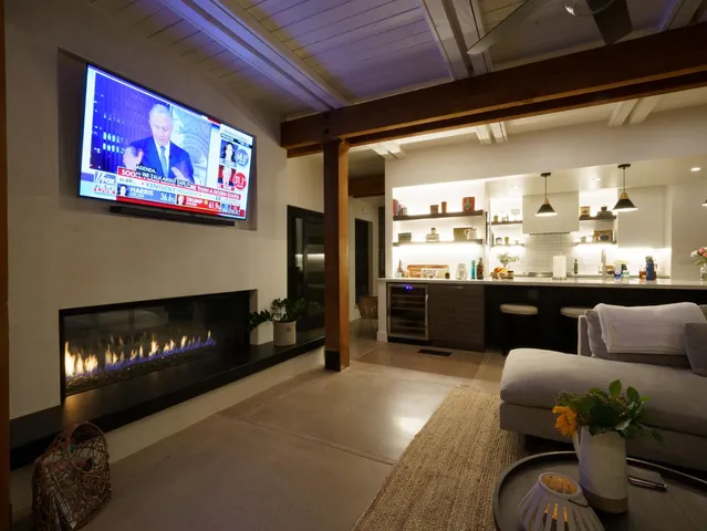 a room with lots of furniture and a large window