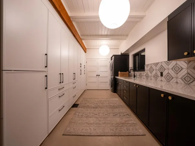 a spacious bedroom with a bed and a large window