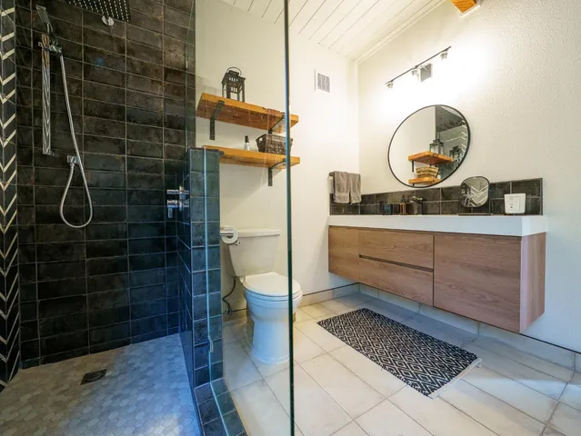 a bedroom with a bed and ceiling fan