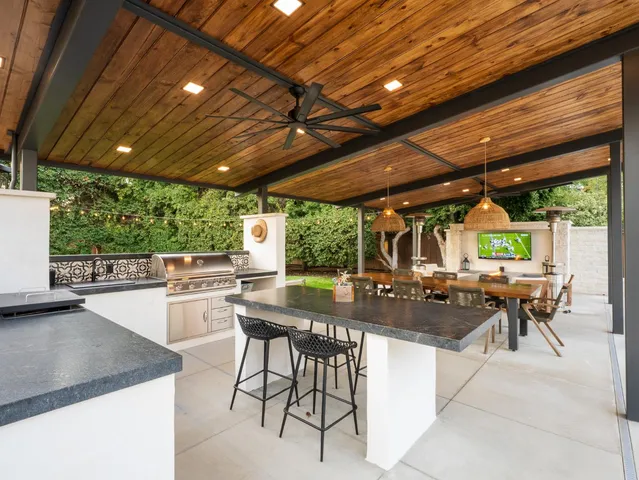 a view of a dining room with furniture a chandelier and chandelier