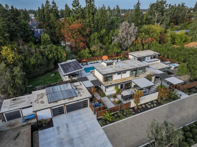 an aerial view of a house with a garden