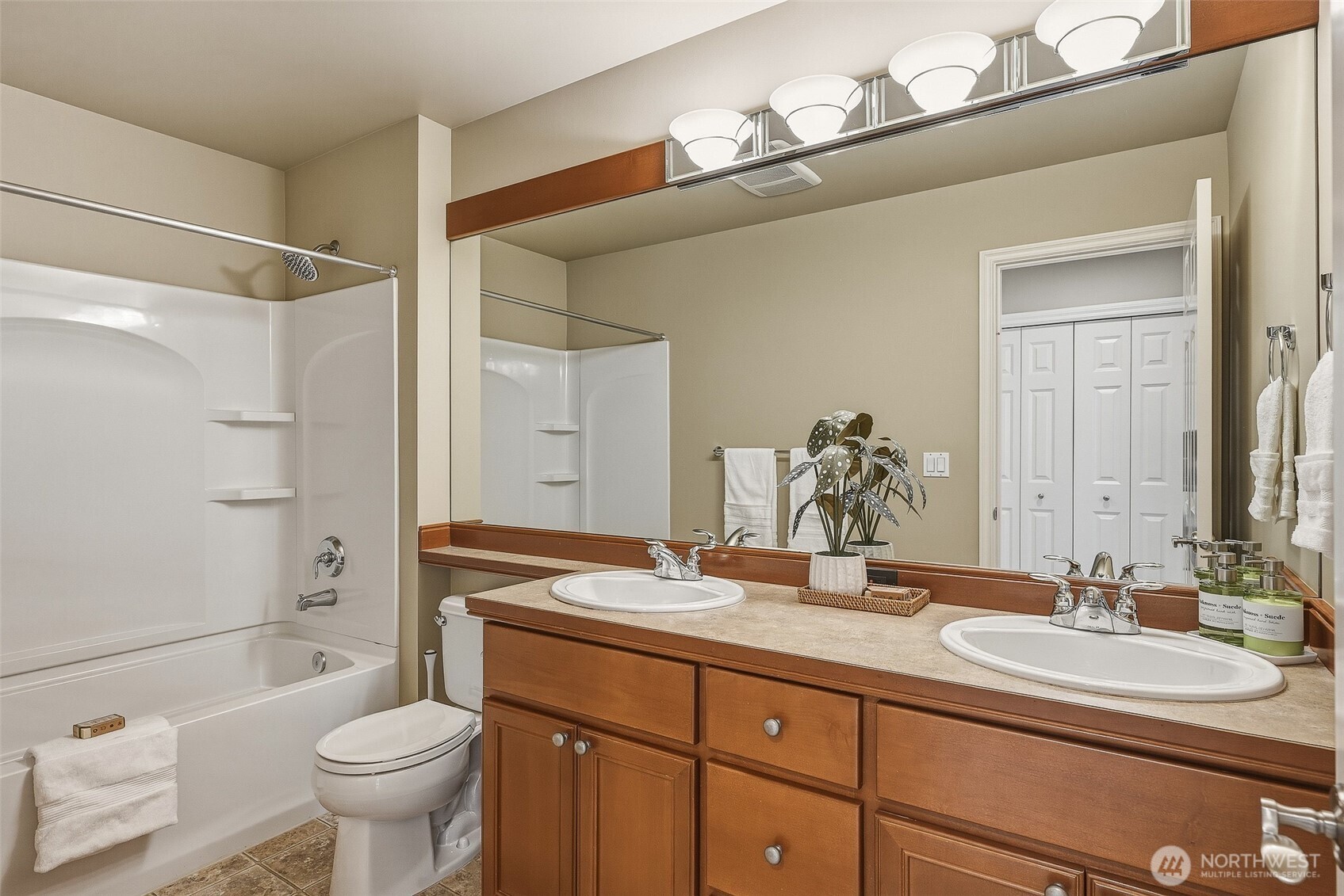 3932 221st Place Southeast Bothell, WA 98021 - Photo 31 of 36 a bathroom with a granite countertop sink toilet and shower