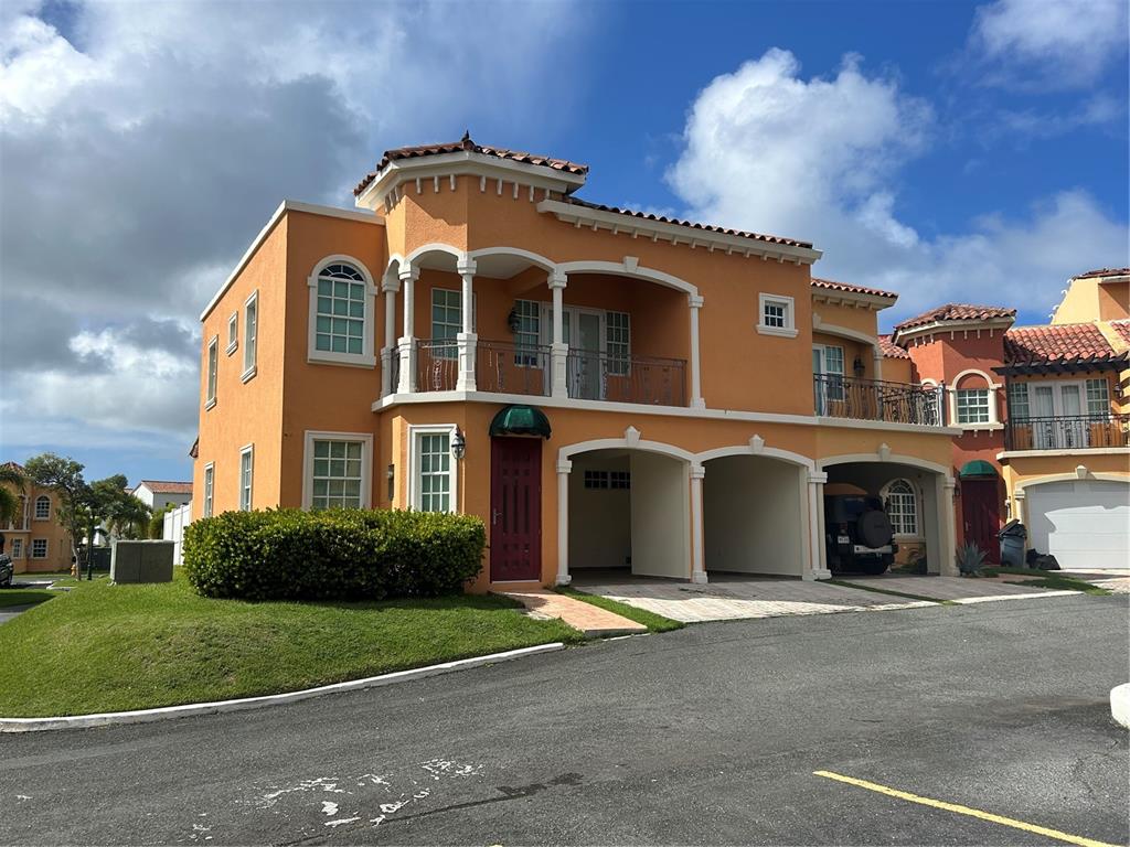11 Brighton Country Club Dorado, PR 00646 - Photo 1 of 1 a front view of a house with a garden