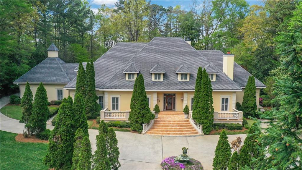3835 Paces Ferry Road Northwest Atlanta, GA 30327 - Photo 1 of 1 front view of a house with a yard