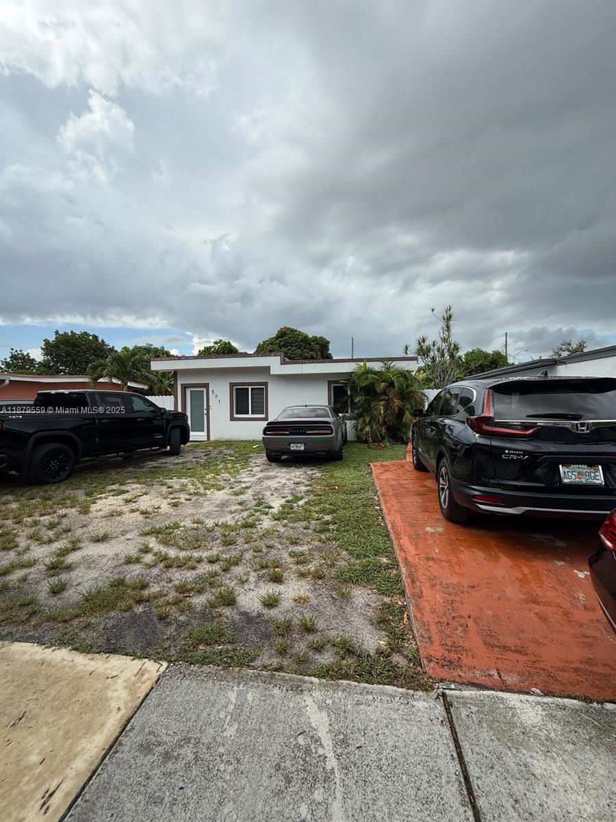 a car parked in front of a house