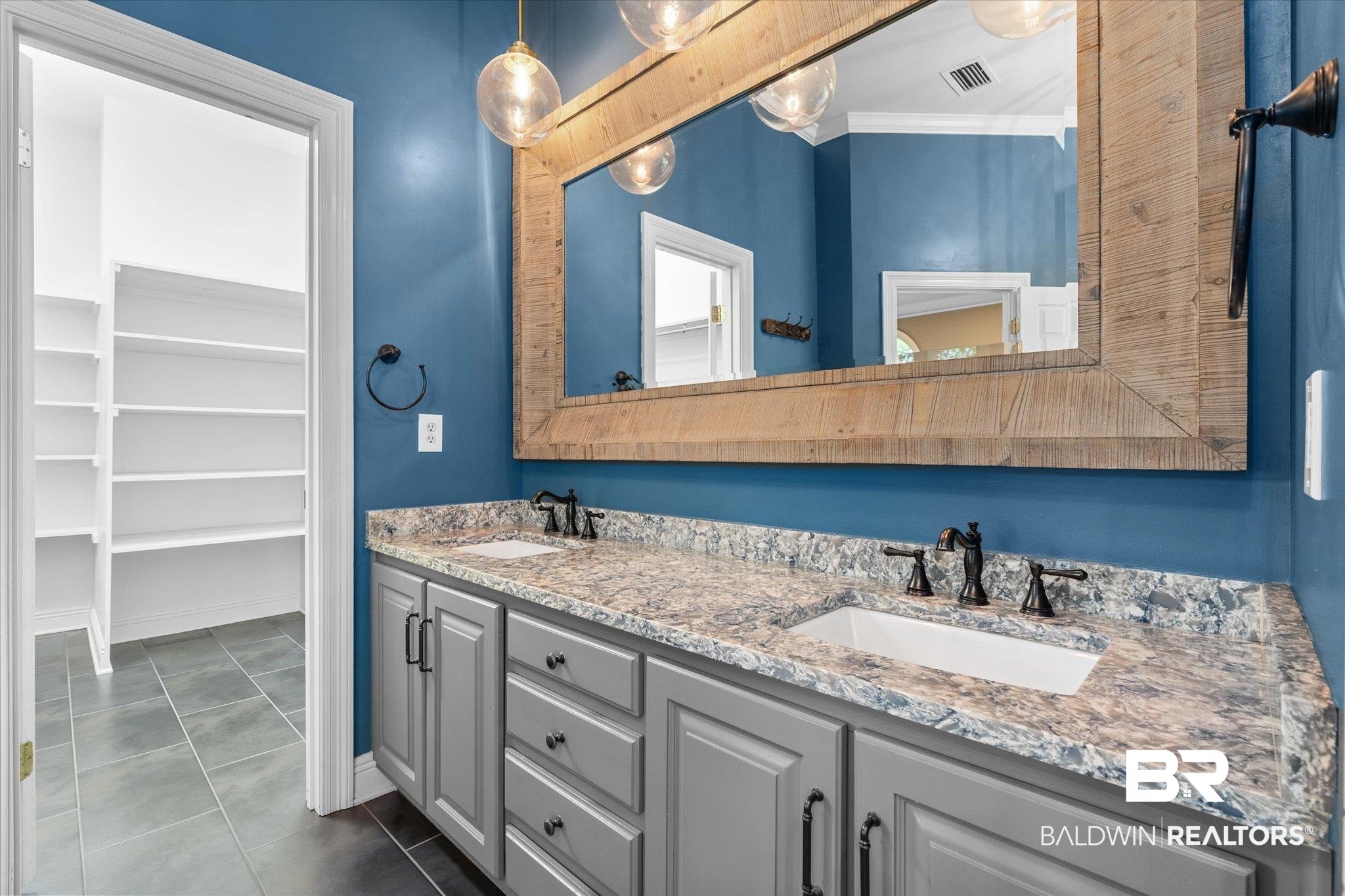 5231 Dawes Road Grand Bay, AL 36541 - Photo 16 of 49 Bathroom featuring vanity, crown molding, and tile patterned floors