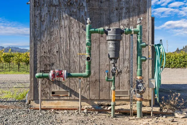 a view of hall with wooden floor and chair