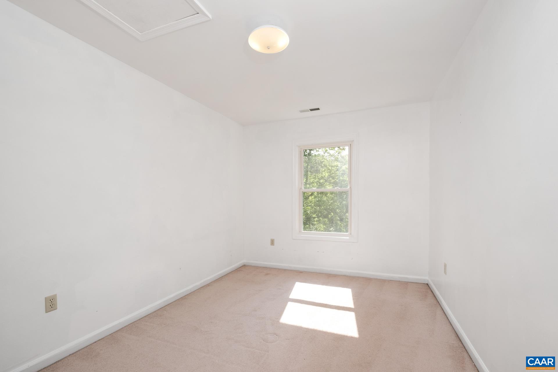 326 Riverside Avenue Charlottesville, VA 22902 - Photo 20 of 38 an empty room with a empty space and window