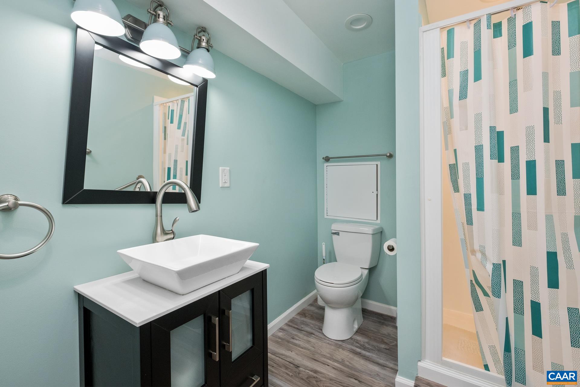 326 Riverside Avenue Charlottesville, VA 22902 - Photo 32 of 38 a bathroom with a sink toilet a mirror and shower
