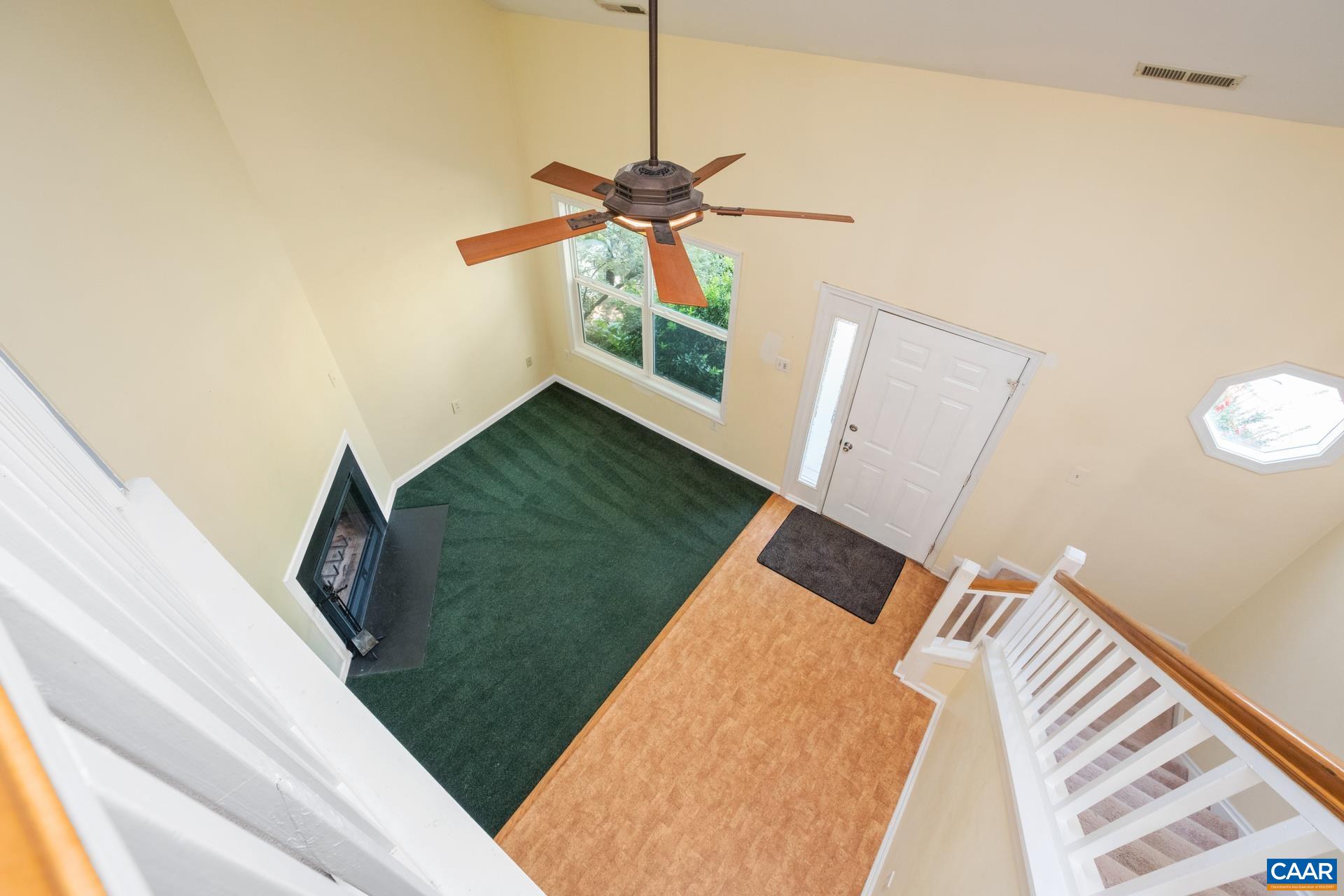 326 Riverside Avenue Charlottesville, VA 22902 - Photo 4 of 38 a living room with a bed furniture and a wooden floor