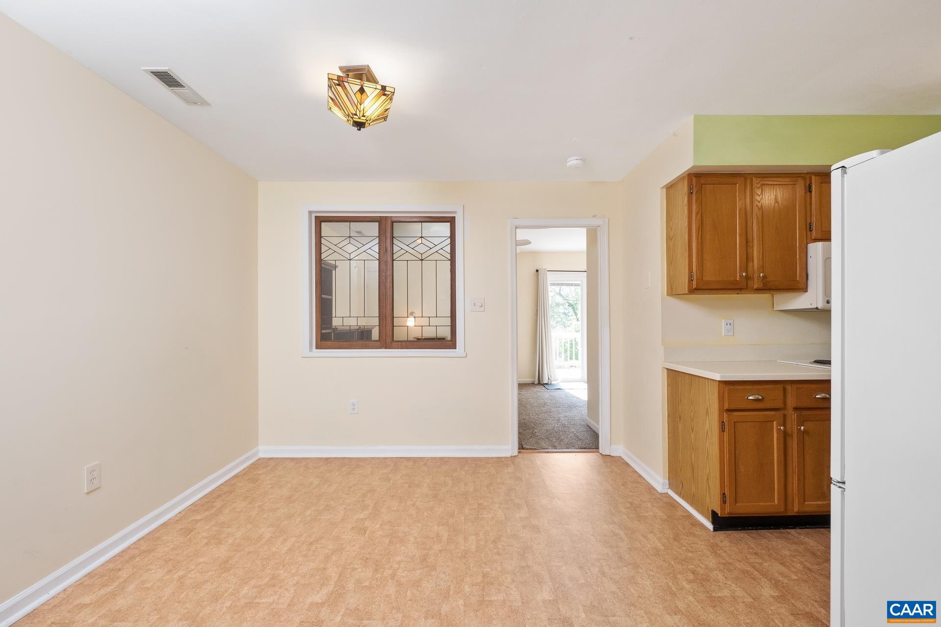 326 Riverside Avenue Charlottesville, VA 22902 - Photo 6 of 38 a view of an empty room with window and cabinet