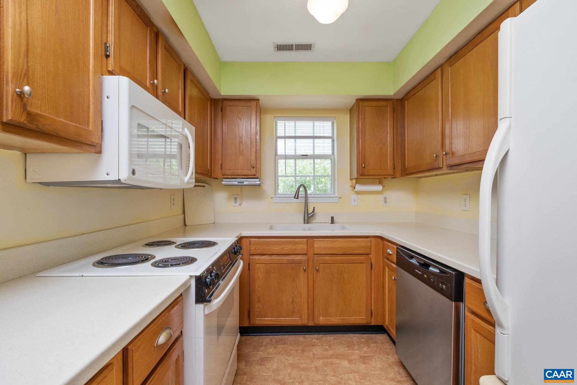 326 Riverside Avenue Charlottesville, VA 22902 - Photo 7 of 38 a kitchen with a sink stove and cabinets