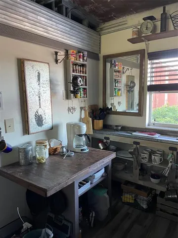a sitting area with wooden floor and outdoor seating