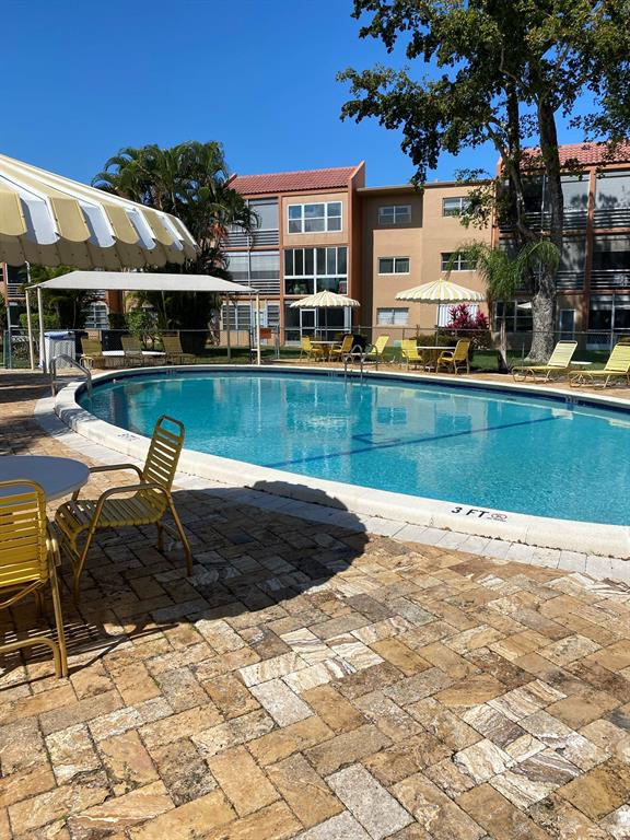 8838 West McNab Road, Unit 201 Tamarac, FL 33321 - Photo 20 of 20 a view of a house with swimming pool