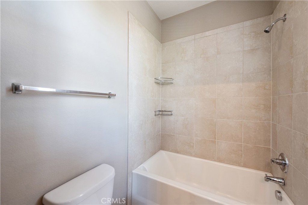 148 Compass Irvine, CA 92618 - Photo 13 of 15 a bathroom with a bathtub and a toilet