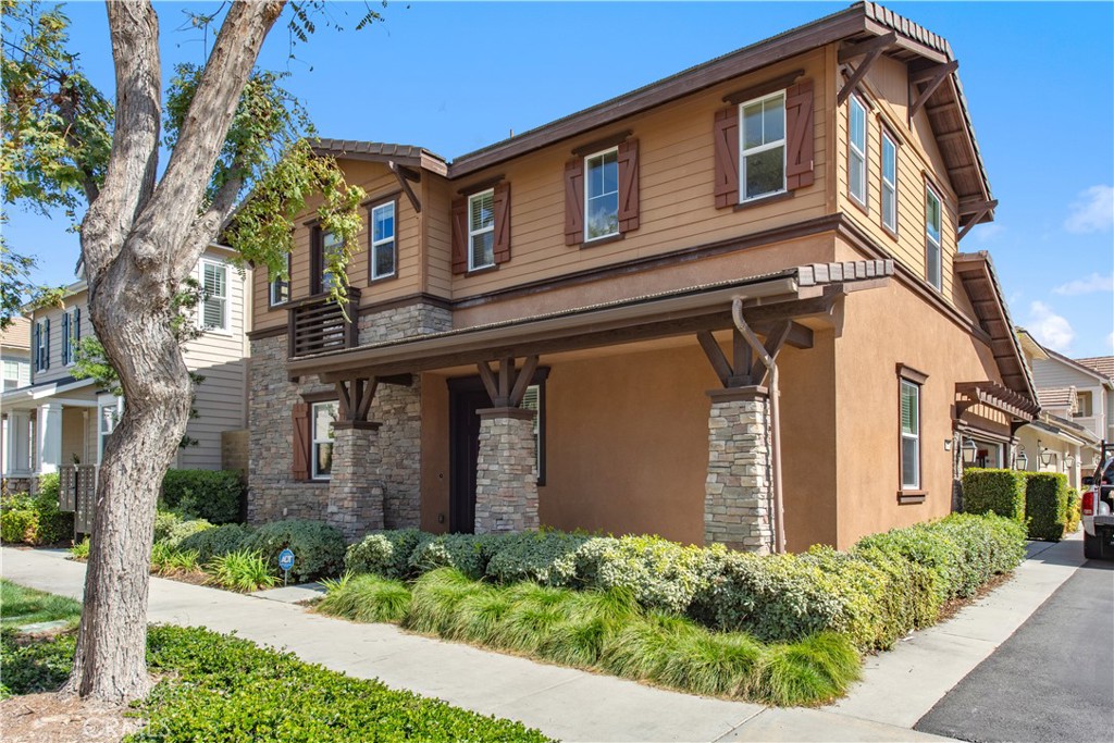 148 Compass Irvine, CA 92618 - Photo 2 of 15 a front view of a house with garden