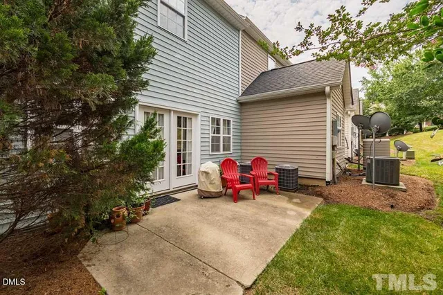 a front view of a house with a yard and a garage