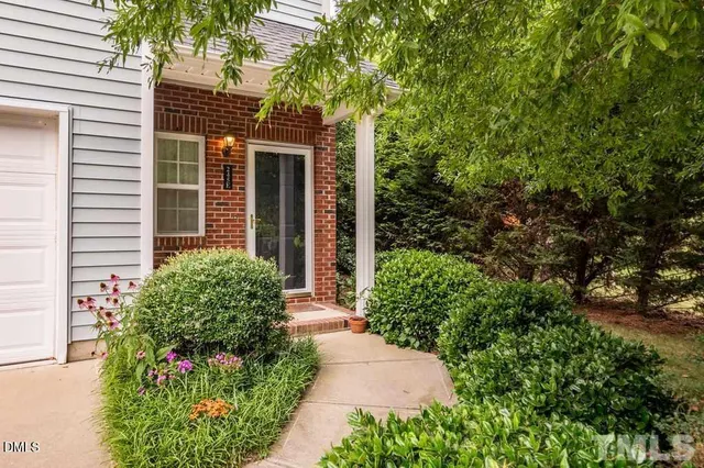 a view of a park that has large trees