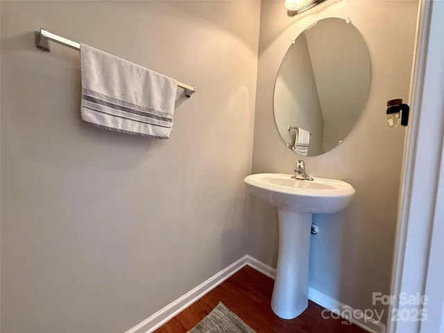 a bathroom with a sink and mirror