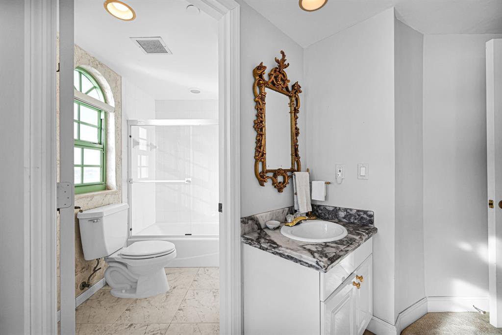 301 North Birch Road, Unit 6S Fort Lauderdale, FL 33304 - Photo 13 of 20 a bathroom with a sink toilet and shower