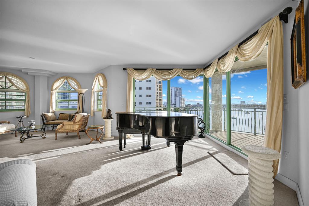 301 North Birch Road, Unit 6S Fort Lauderdale, FL 33304 - Photo 2 of 20 a living room with furniture and a large window