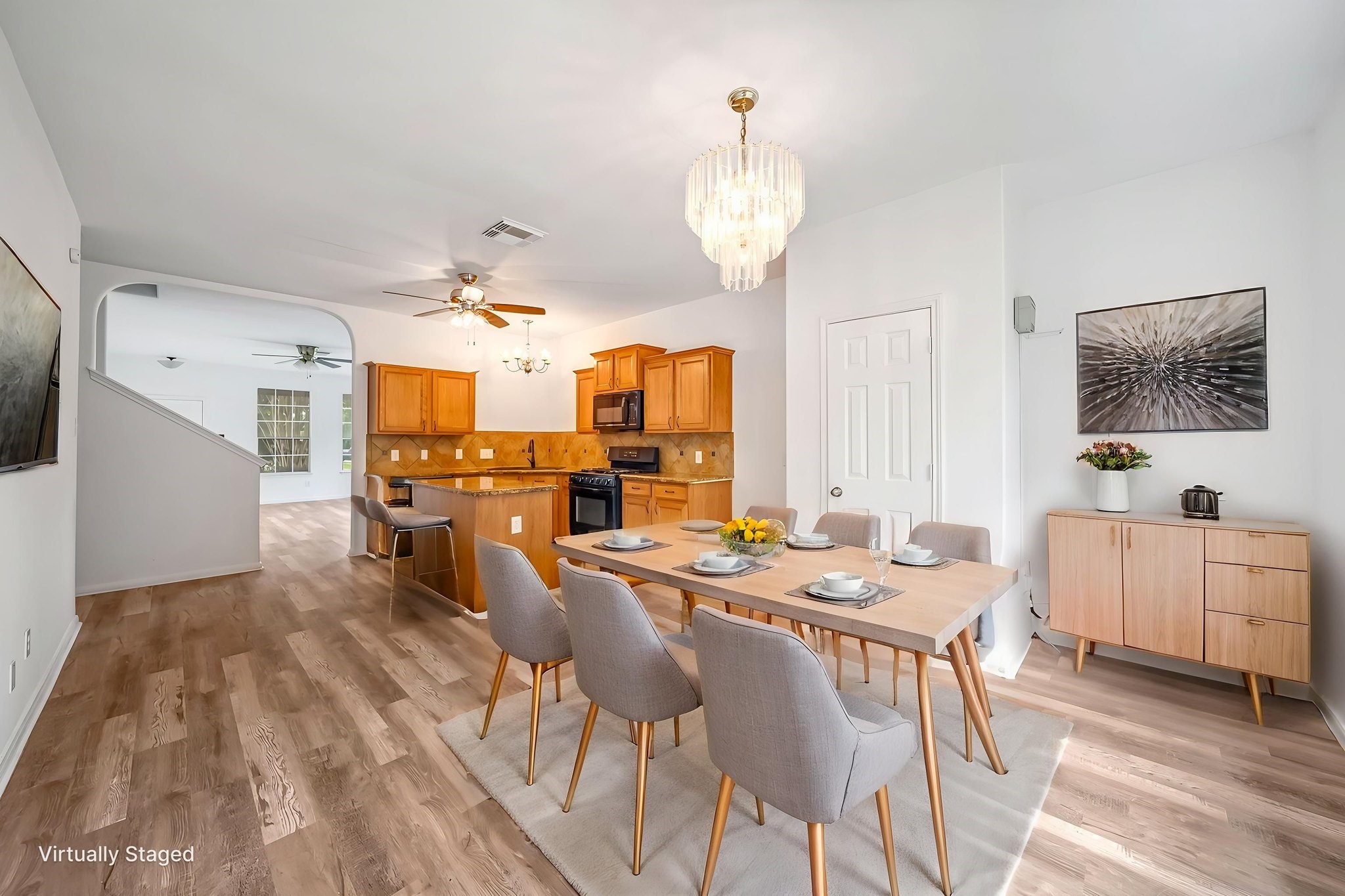 23526 Whispering Maple Drive Spring, TX 77373 - Photo 8 of 26 a view of a dining room with furniture and wooden floor