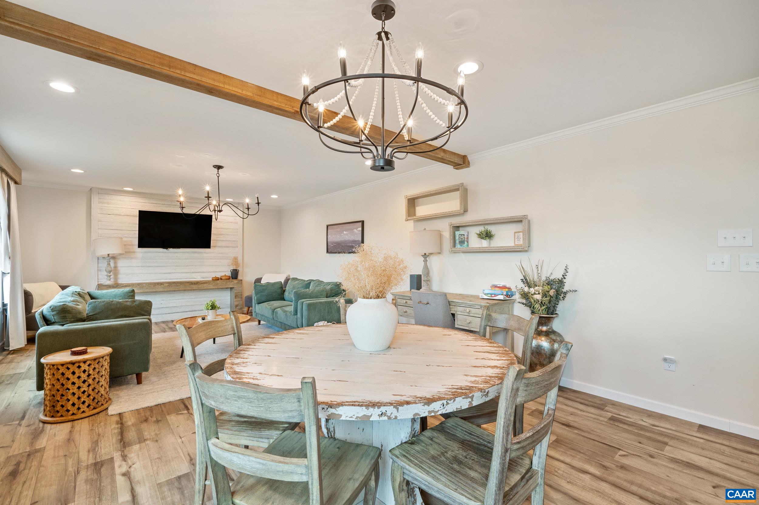 1600 Rock Spring Road Shipman, VA 22971 - Photo 12 of 74 a view of a dining room with furniture a chandelier and wooden floor