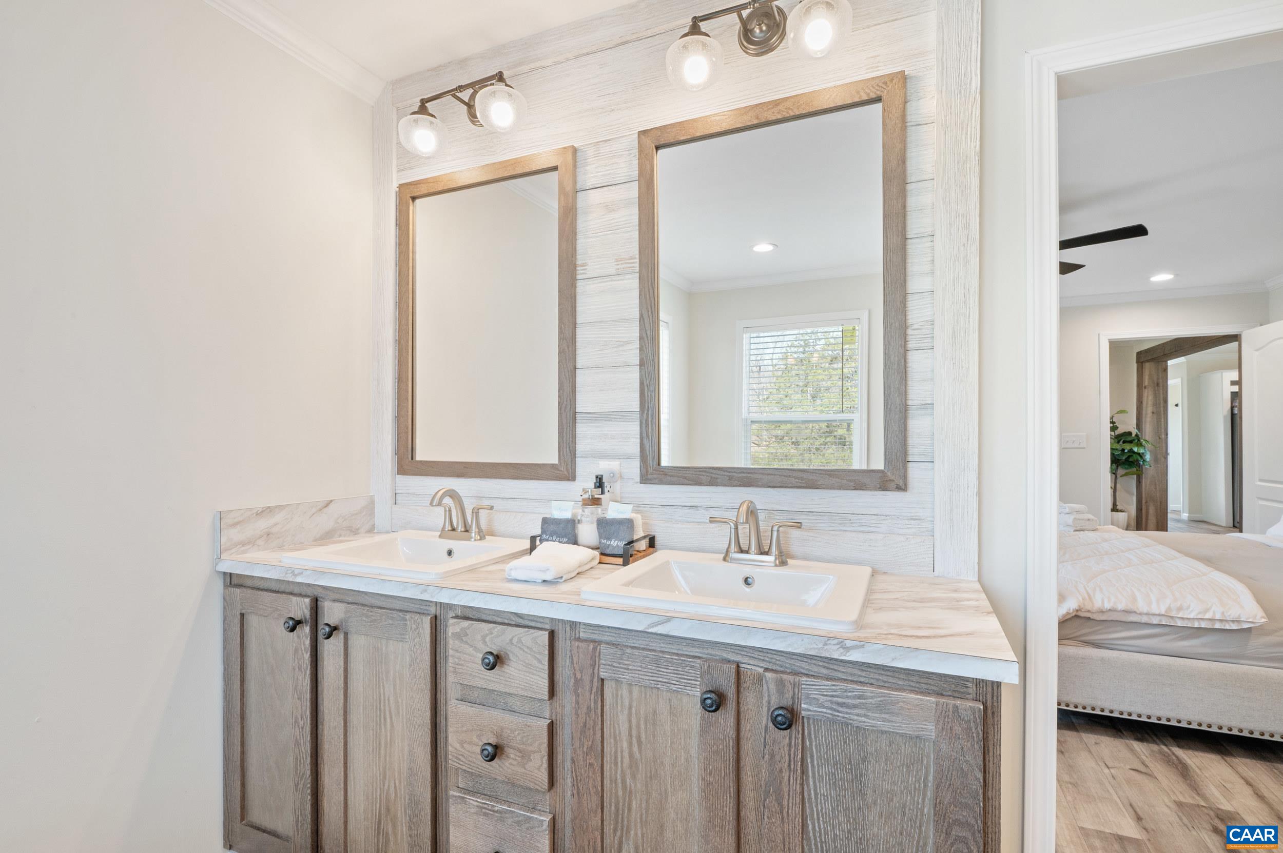 1600 Rock Spring Road Shipman, VA 22971 - Photo 29 of 74 a bathroom with a sink double vanity and a mirror