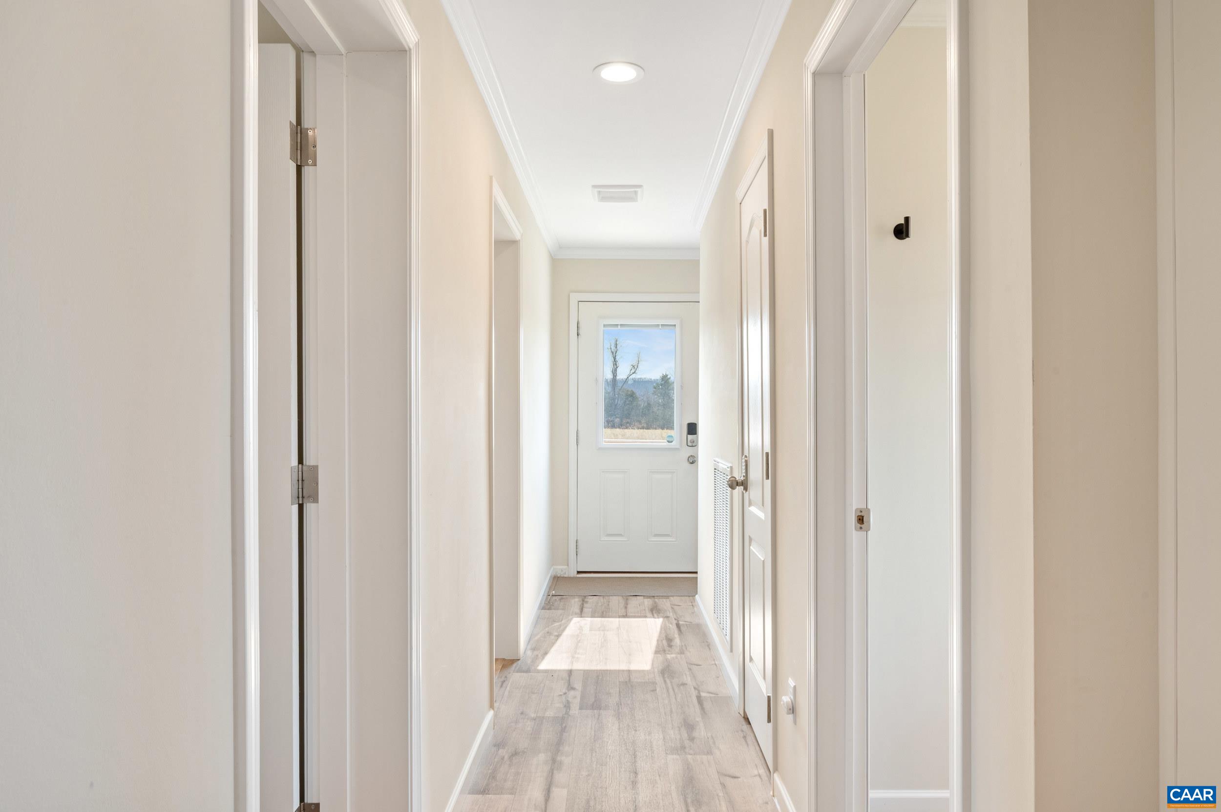 1600 Rock Spring Road Shipman, VA 22971 - Photo 31 of 74 a view of a hallway with wooden floor and a bathroom