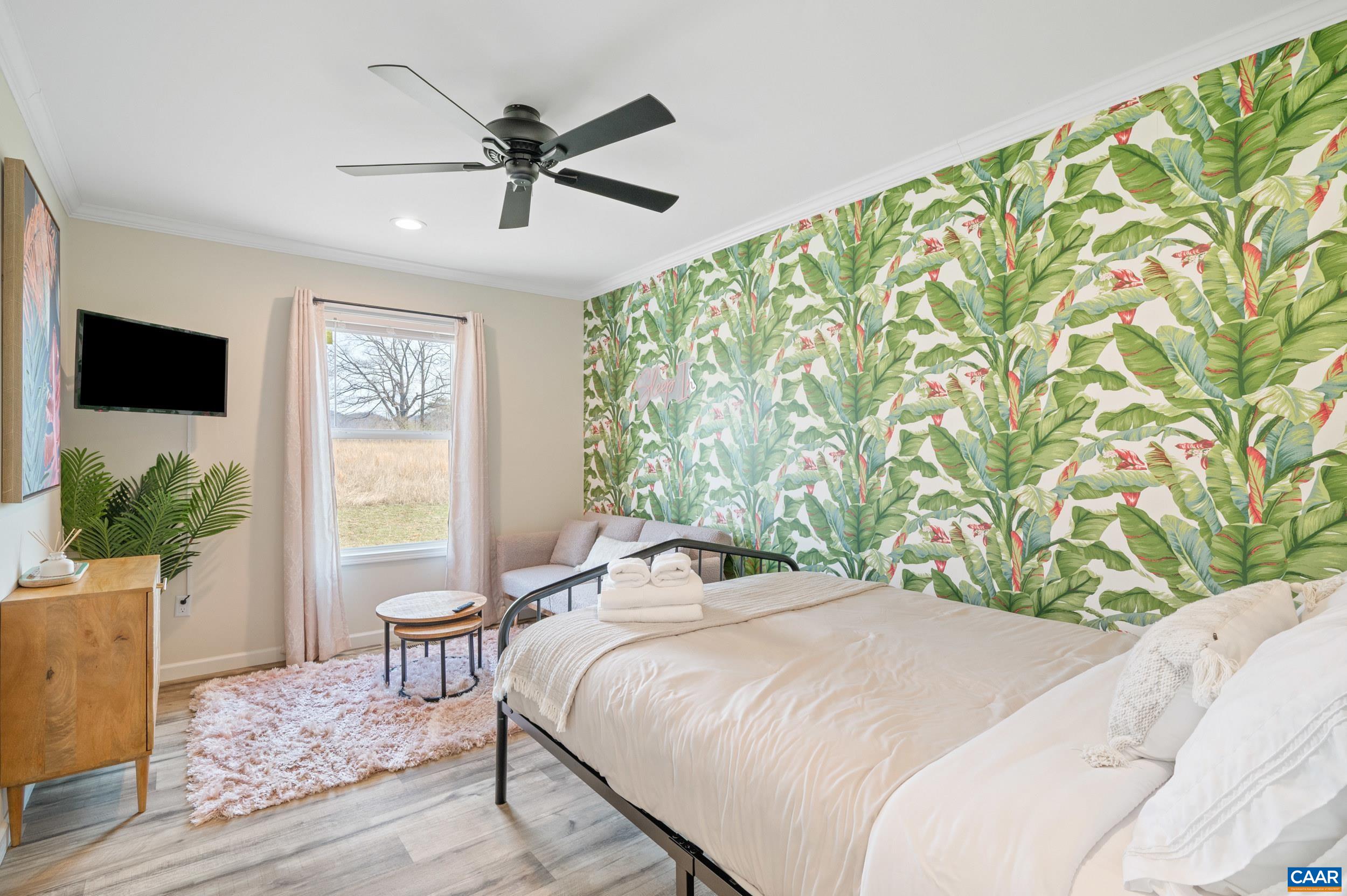 1600 Rock Spring Road Shipman, VA 22971 - Photo 37 of 74 a bedroom with a bed and glass window