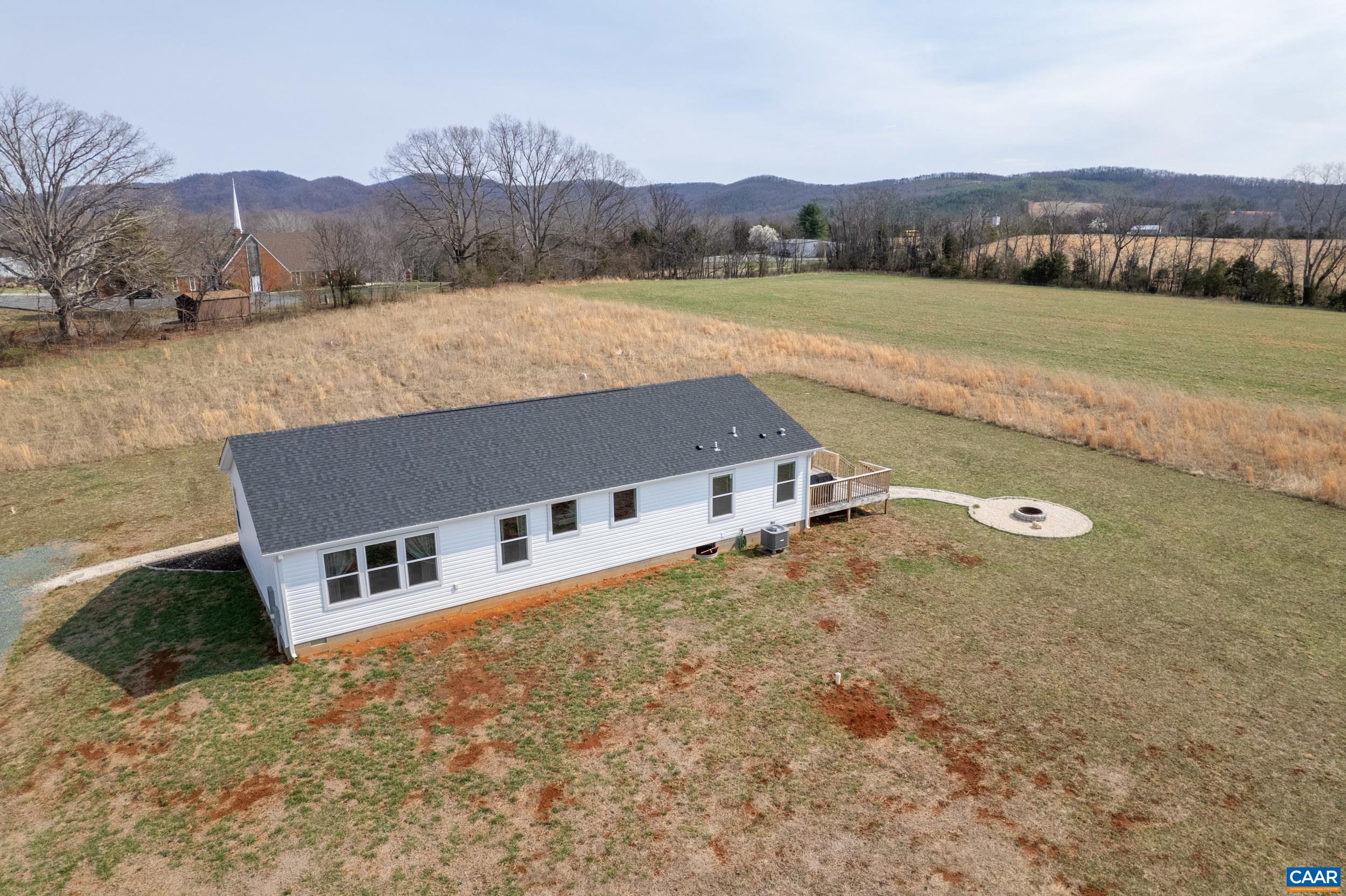 1600 Rock Spring Road Shipman, VA 22971 - Photo 53 of 74 a aerial view of a house with a yard and lake view