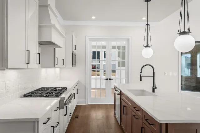 a view of an entryway with wooden floor and windows